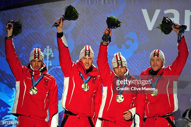Team Austria celebrates winning the silver medal during the medal ceremony for the men's 4 x 7.5 km biathlon relay on day 15 of the Vancouver 2010...