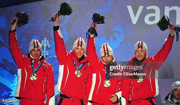 Team Austria celebrates winning the silver medal during the medal ceremony for the men's 4 x 7.5 km biathlon relay on day 15 of the Vancouver 2010...