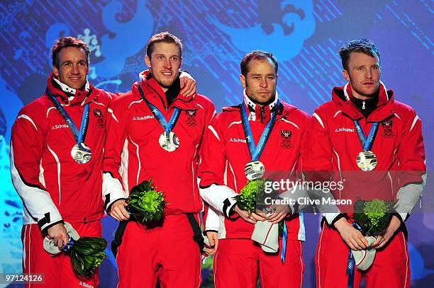 Team Austria celebrates winning the silver medal during the medal ceremony for the men's 4 x 7.5 km biathlon relay on day 15 of the Vancouver 2010...