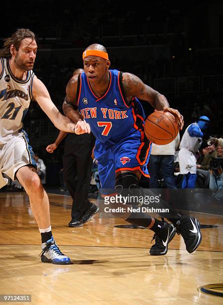 Al Harrington of the New York Knicks drives against Fabricio Oberto of the Washington Wizards at the Verizon Center on February 26, 2010 in...
