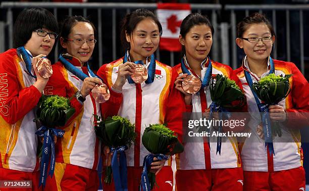 Jinli Liu, Yan Zhou, Qingshuang Yue, Yin Liu, Bingyu Wang of China celebrate winning the bronze medal after victory over Switzerland in the women's...