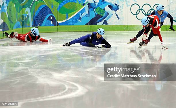 Charles Hamelin of Canada leads from Apolo Anton Ohno of the United States as Francois-Louis Tremblay of Canada and Sung Si-Bak of South Korea crash...
