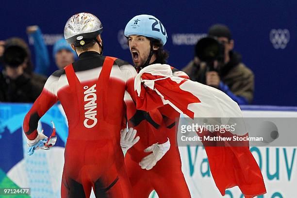 Gold medalist Charles Hamelin of Canada celebrates with bronze medalist Francois-Louis Tremblay of Canada in the Men's 500m Short Track Speed Skating...