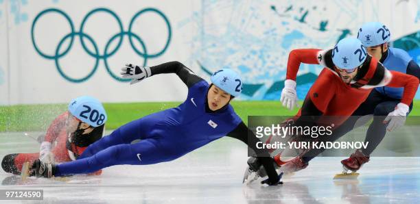 Gold medallist, Canada's Charles Hamelin , competes with silver medallist, South Korea's Si-Bak Sung and bronze medallist, Canada's Francois-Louis...