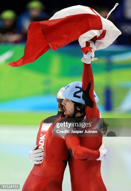 Gold medalist Charles Hamelin of Canada celebrates with bronze medalist Francois-Louis Tremblay of Canada in the Men's 500m Short Track Speed Skating...