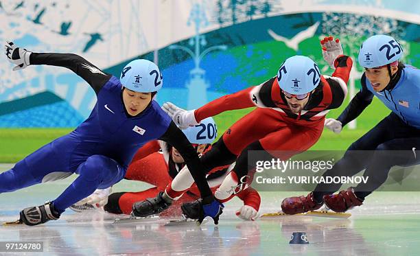 Gold medallist, Canada's Charles Hamelin , competes with silver medallist, South Korea's Si-Bak Sung and bronze medallist, Canada's Francois-Louis...