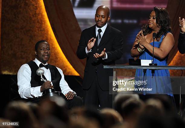 Actor Daryl Mitchell accepts the Oustanding Actor in a Comedy Series award from actress Sherri Shepherd onstage during the 41st NAACP Image awards...