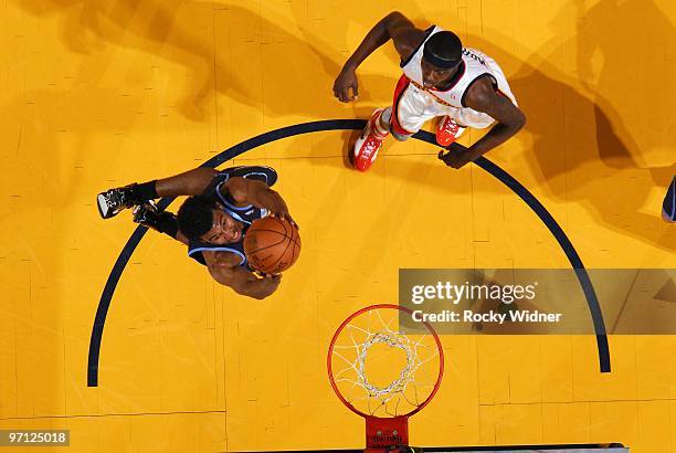 Ronnie Price of the Utah Jazz takes the ball to the basket against Anthony Morrow of the Golden State Warriors during the game at Oracle Arena on...