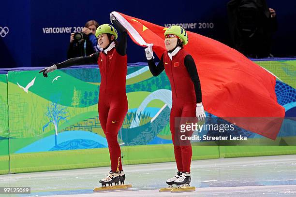 Gold medalist Wang Meng of China celebrates with Zhou Yang in the Ladies 1000m Short Track Speed Skating Final on day 15 of the 2010 Vancouver Winter...