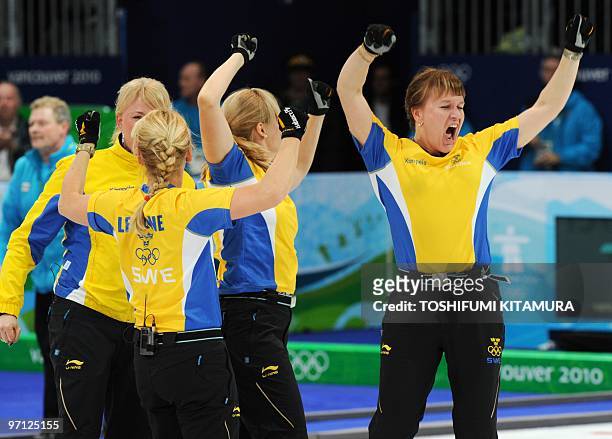 Sweden's Cathrine Lindahl shouts in jubilation with her teammates after their gold medal match in the Vancouver Winter Olympics women's curling games...