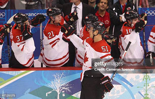 Ryan Getzlaf#51 of Canada celebrates with his team mates after he scored past Goalkeeper Jaroslav Halak of Slovakia during the ice hockey men's...