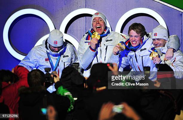 Ole Einar Bjoerndalen, Emil Hegle Svendsen, Tarjei Boe and Halvard Hanevold of Norway celebrate winning the gold medal during the medal ceremony for...