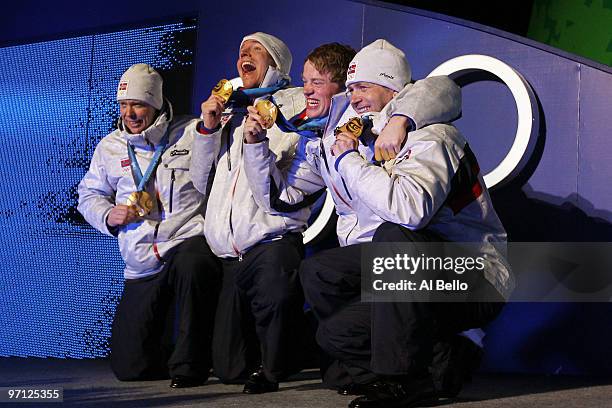 Ole Einar Bjoerndalen, Emil Hegle Svendsen, Tarjei Boe and Halvard Hanevold of Norway celebrate winning the gold medal during the medal ceremony for...