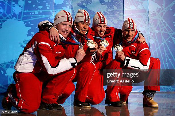 Team Austria celebrates winning the silver medal during the medal ceremony for the men's 4 x 7.5 km biathlon relay on day 15 of the Vancouver 2010...