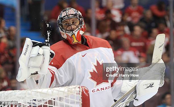 Goalkeeper Roberto Luongo of Canada looks at his water bottle during the ice hockey men's semifinal game between the Canada and Slovakia on day 15 of...