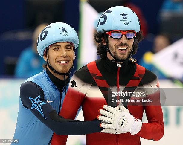Relay Gold medalist Charles Hamelin of Canada smiles with bronze medalist Apolo Anton Ohno of the United States after the Men's 5000m Relay Short...