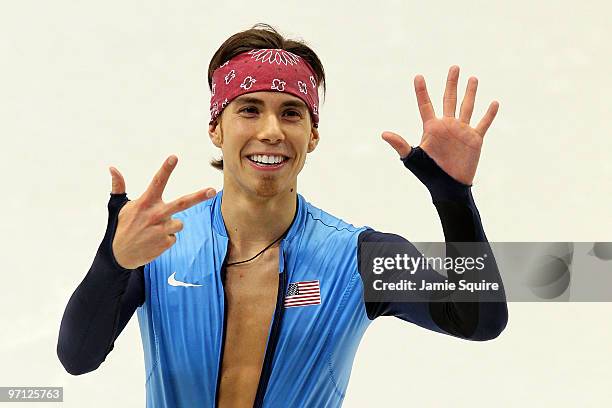 Bronze medalist Apolo Anton Ohno of the United States holds up eight fingers to signifty his tally of Olympic medals after the Men's 5000m Relay...