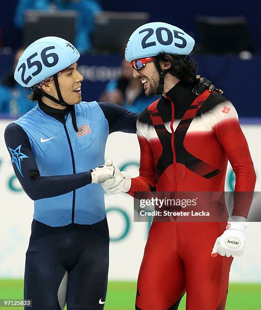 Relay Gold medalist Charles Hamelin of Canada smiles with bronze medalist Apolo Anton Ohno of the United States after the Men's 5000m Relay Short...