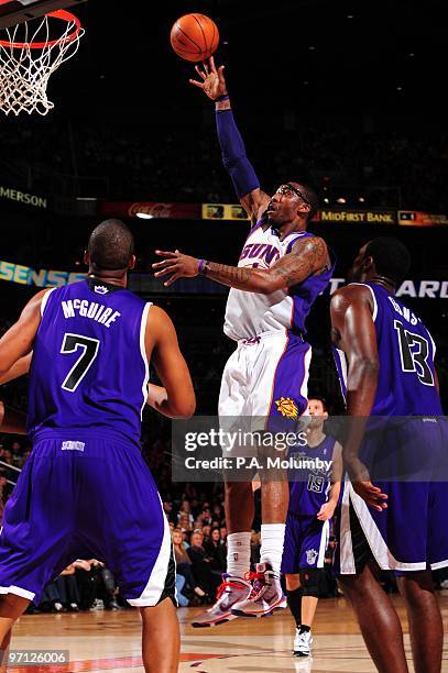 Amar'e Stoudemire of the Phoenix Suns puts up a shot against Dominic McGuire and Tyreke Evans of the Sacramento Kings during the game at U.S. Airways...