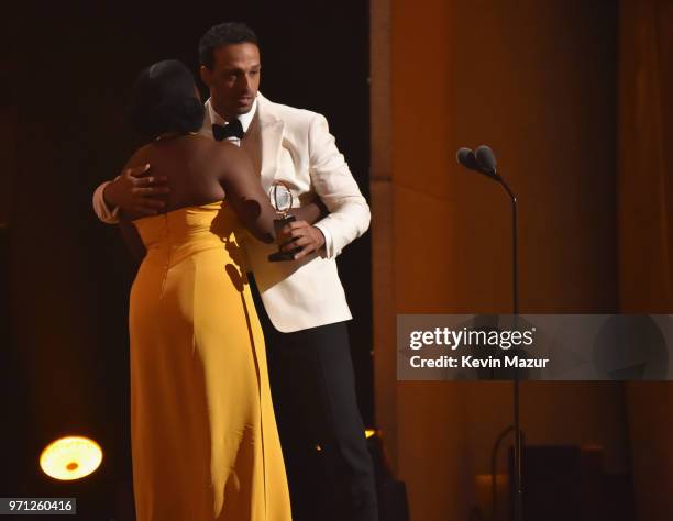 Ariel Stachel accepts the award for Best Performance by an Actor in a Featured Role in a Musical for The Band's Visit from Uzo Aduba during the 72nd...