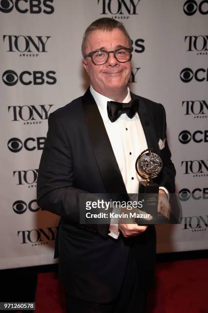 Nathan Lane poses with his award for Best Performance by an Actor in a Featured Role in a Play award for Angels in America backstage during the 72nd...