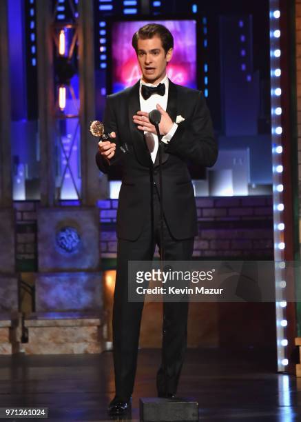 Andrew Garfield accepts the Best Performance by an Actor in a Leading Role in a Play for Angels in America onstage during the 72nd Annual Tony Awards...