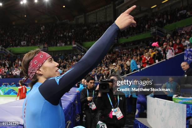 Bronze medalist Apolo Anton Ohno of the United States celebrates winning his eighth Olympic medal after the Men's 5000m Relay Short Track Speed...