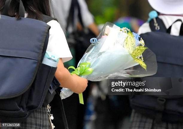 School pupils arrive at the school on the 17th anniversary of the stabbing rampage at the Osaka Kyoiku University Ikeda Elementary School on June 8,...