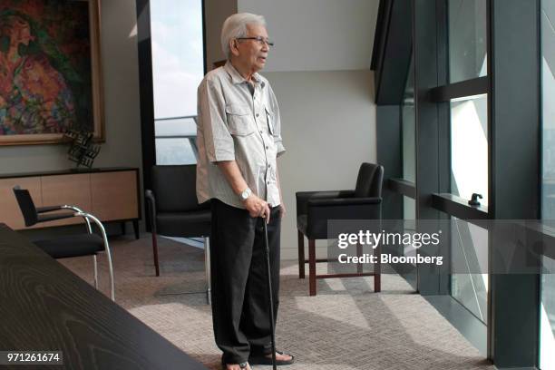 Daim Zainuddin, a member of Malaysia Prime Minister Mahathir Mohamad's advisory council, stands for a photograph in his office in Kuala Lumpur,...