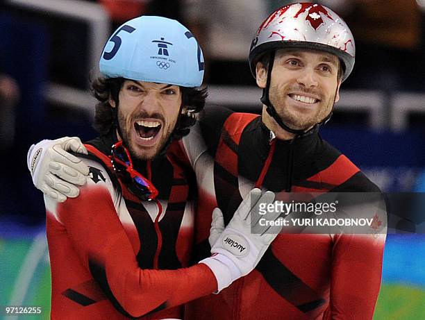 Gold medallist, Canada's Charles Hamelin celebrates with compatriot, bronze medallist Francois-Louis Tremblay at the end of the Men's 500 m...
