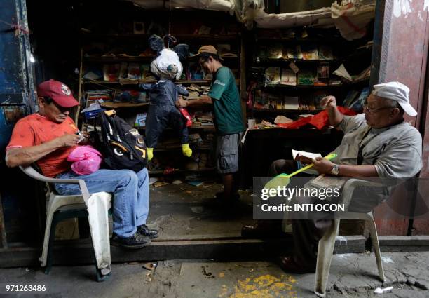 Man makes a "pinatas" , on June 9, 2018 at Managua's largest market, Mercado Oriental, where vendors say they are already feeling the economic strain...