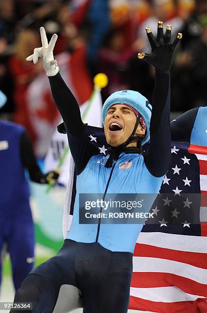 Bronze medallist, US Apolo Anton Ohno, shows the number 8 as he celebrates his eighth Olympic medal at the end of the Men's 5000 m relay short-track...