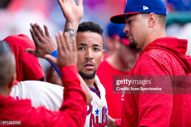 Philadelphia Phillies Infield J.P. Crawford celebrates with teammates in the dugout after scoring in the fifth inning during the game between the...