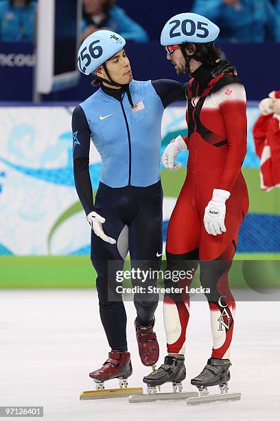 Relay Gold medalist Charles Hamelin of Canada talks with bronze medalist Apolo Anton Ohno of the United States after the Men's 5000m Relay Short...