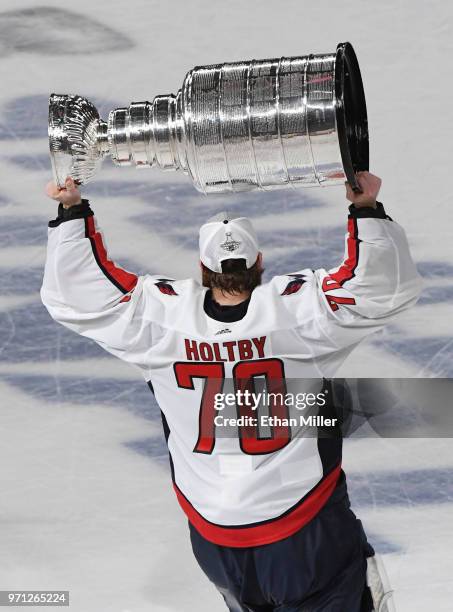 Braden Holtby of the Washington Capitals hoists the Stanley Cup after Game Five of the 2018 NHL Stanley Cup Final at T-Mobile Arena on June 7, 2018...