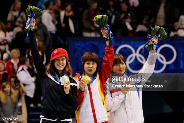 Gold medalist Wang Meng of China celebrates with silver medalist Katherine Reutter of the United States and bronze medalist Park Seung-Hi of South...