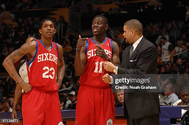 Louis Williams and Jrue Holida of the Philadelphia 76ers receive direction from Head Coach Eddie Jordan during a game against the Los Angeles Lakers...