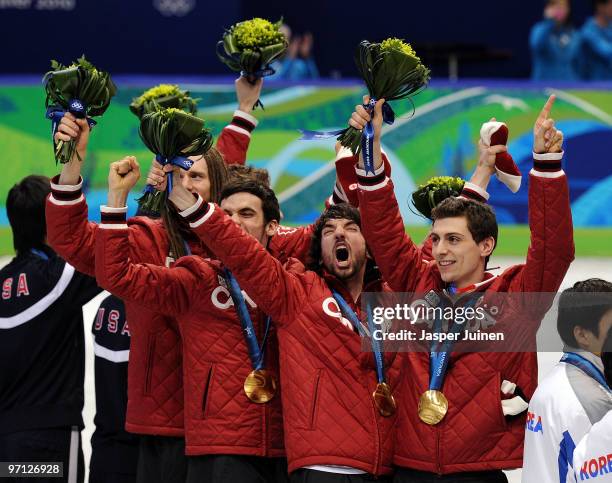Charles Hamelin of Canada celebrates the gold medal with team mates Olivier Jean, Francois Hamelin, Francois-Louis Tremblay and Guillaume Bastille...