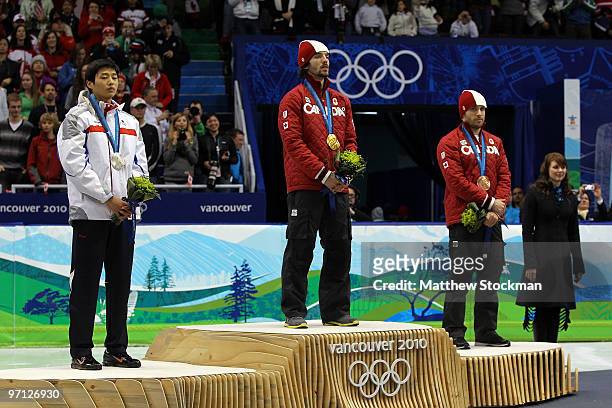 Sung Si-Bak of South Korea celebrates winning the silver medal, Charles Hamelin of Canada gold and Francois-Louis Tremblay of Canada bronze during...