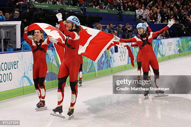 Charles Hamelin, Olivier Jean, Francois Hamelin, Francois-Louis Tremblay and Guillaume Bastille of Canada celebrate the gold medal after the Men's...