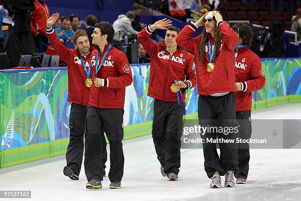 Charles Hamelin, Olivier Jean, Francois Hamelin, Francois-Louis Tremblay and Guillaume Bastille of Canada celebrate the gold medal after the Men's...