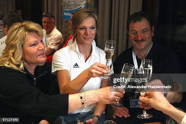 Maria Riesch of Germany celebrates with her parents Monika Riesch and Siegfried Riesch winning two gold medals for the ladies' super combined and...