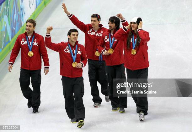 Charles Hamelin, Olivier Jean, Francois Hamelin, Francois-Louis Tremblay and Guillaume Bastille of Canada celebrate the gold medal after the Men's...