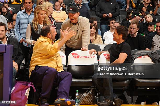 Producer Joel Silver and actor Rob Lowe are greeted by Director Ron Howard during halftime of a game between the Philadelphia 76ers and the Los...