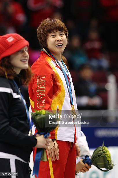 Wang Meng of China celebrates winning the gold medal in the Ladies 1000m Short Track Speed Skating Final on day 15 of the 2010 Vancouver Winter...
