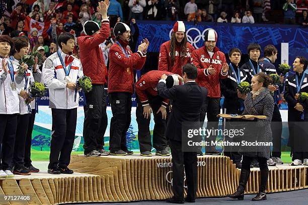 Charles Hamelin, Olivier Jean, Francois Hamelin, Francois-Louis Tremblay and Guillaume Bastille of Canada celebrate the gold medal after the Men's...