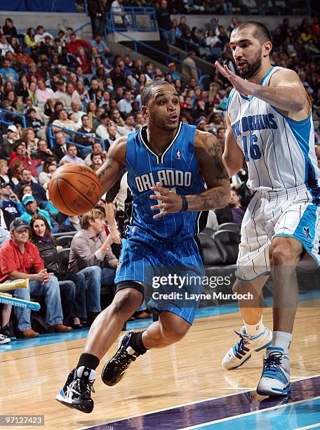 Jameer Nelson of the Orlando Magic drives on Peja Stojakovic of the New Orleans Hornets on February 26, 2010 at the New Orleans Arena in New Orleans,...