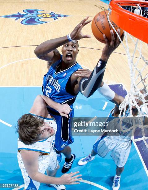 Dwight Howard of the Orlando Magic shoots over Aaron Gray of the New Orleans Hornets on February 26, 2010 at the New Orleans Arena in New Orleans,...