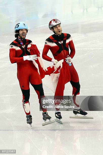 Gold medalist Charles Hamelin of Canada celebrates with bronze medalist Francois-Louis Tremblay of Canada in the Men's 500m Short Track Speed Skating...