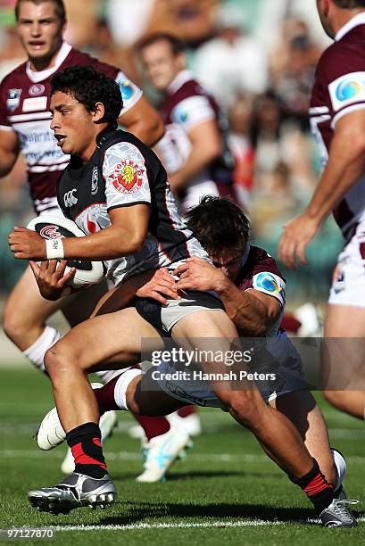 Kevin Locke of the Warriors makes a break during the NRL trial match between the Warriors and the Manly Warringah Sea Eagles at North Harbour Stadium...